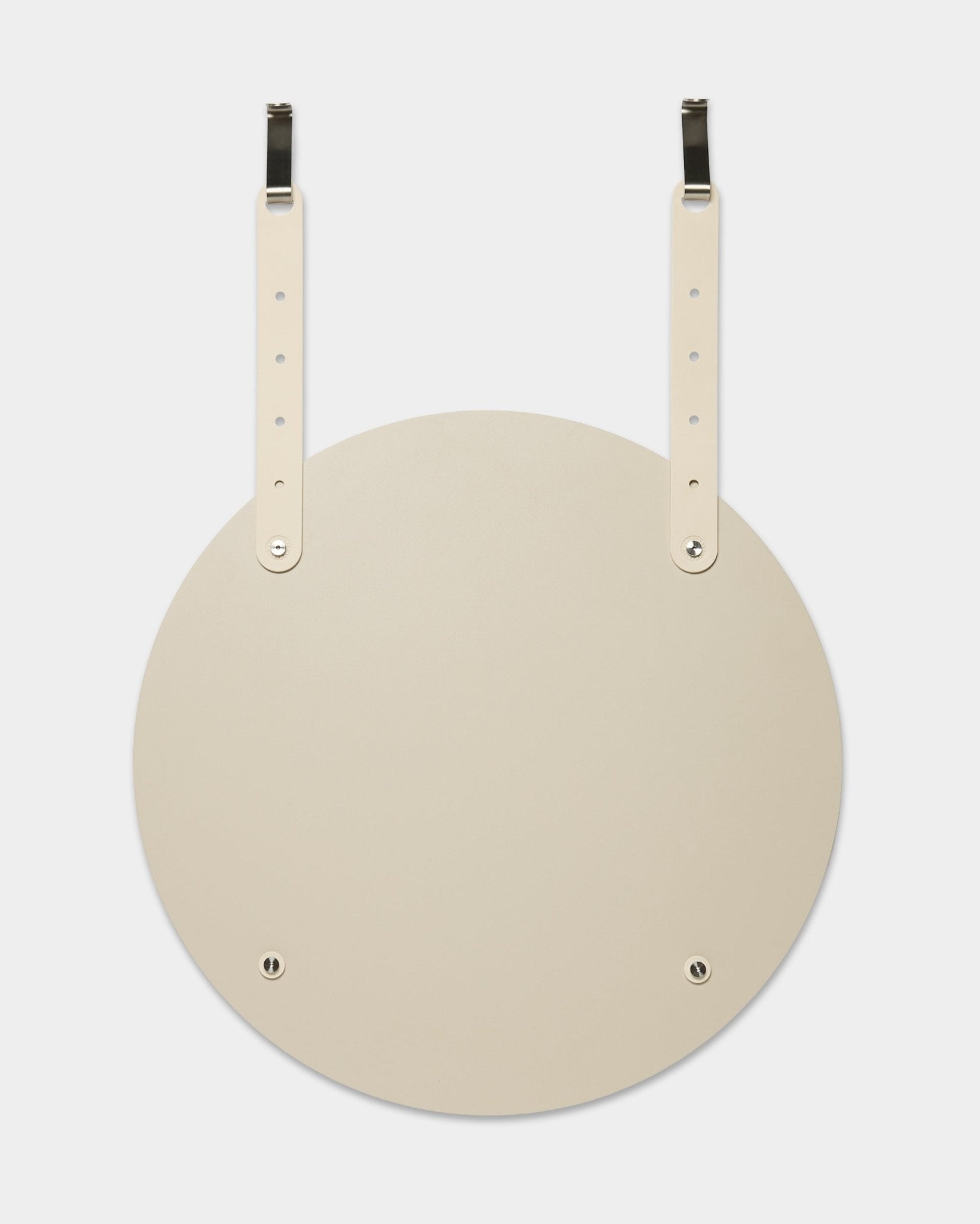 Vala | Spegel / BM1 från WoodUpp är en rund beige väggspegel med justerbara läderremmar för upphängning; installationen kräver ingen borrning i väggen.