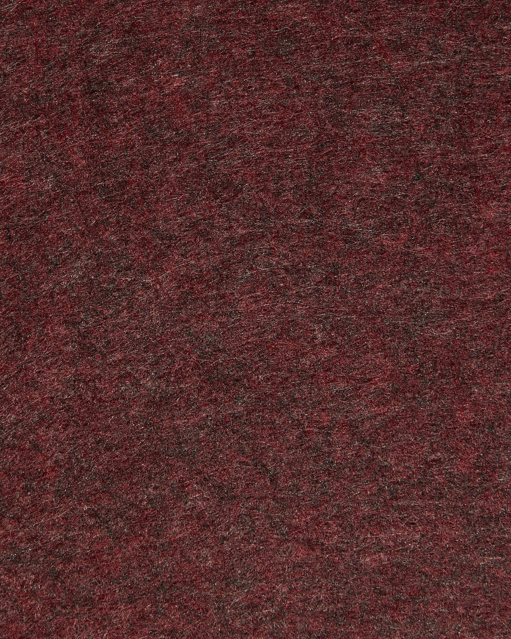 Närbild av WoodUpp Vigg | Felt Box / BM2 i ox red, med fokus på strukturerad akustikfilt med subtila skiftningar och synliga fibrer.